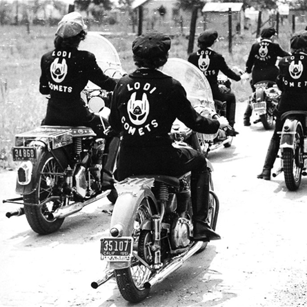 Women motorcycle group with leather jackets on, picture taken in black and white.